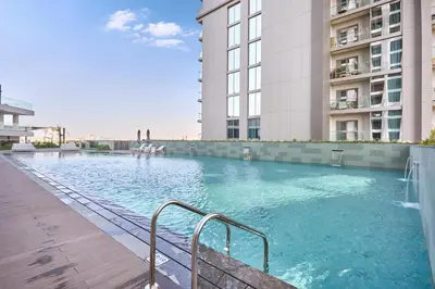 a swimming pool in the middle of a building at STAY BY LATINEM Luxury 2BR Holiday Home CVG 907 Near Burj Khalifa in Dubai