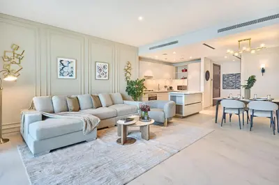 a living room with a couch and a table at STAY BY LATINEM Luxury 2BR Holiday Home CVG 907 Near Burj Khalifa in Dubai