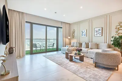 a living room with a couch and a table at STAY BY LATINEM Luxury 2BR Holiday Home CVG 907 Near Burj Khalifa in Dubai