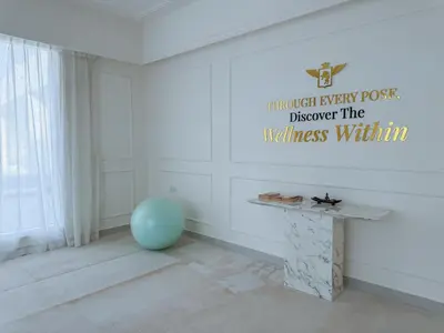 a room with a table and a blue ball at 1BR Lagoon View Luxury Spa Retreat near Miracle Garden in Dubai