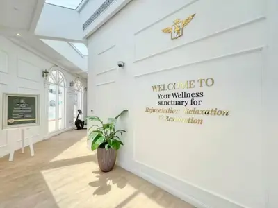 a room with a wall with a sign on it at 1BR Lagoon View Luxury Spa Retreat near Miracle Garden in Dubai