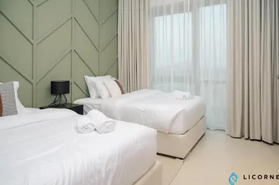 a hotel room with two beds and a window at Brand New Modern 2 BR Retreat in Dubai Creek Harbour in Dubai