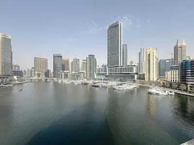 a view of a city with boats in the water at The Point - One Bed with Marina Skyline Views in Dubai