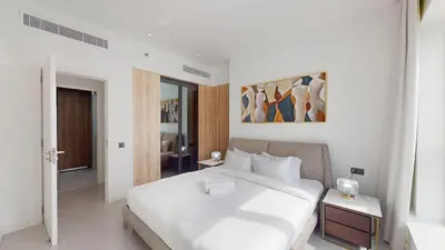 a bedroom with a large white bed in a room at The Point - One Bed with Marina Skyline Views in Dubai