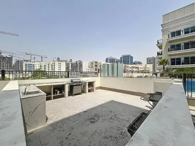 a view of a rooftop of a building at Al Ghaf - Upgraded One Bed with Pool View in Arjan in Dubai