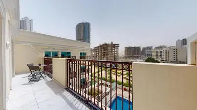 a balcony with a view of a city at Al Ghaf - Upgraded One Bed with Pool View in Arjan in Dubai