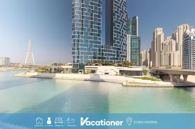 a view of a city with tall buildings and water at 5242 Tower 2 - One Bed, Low Floor with Canal View in Dubai