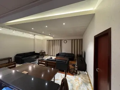 a living room with a couch and a table at Stylish 1BR JBR Beachfront in Dubai