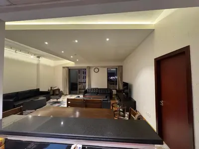 a living room with a couch and a table at Stylish 1BR JBR Beachfront in Dubai