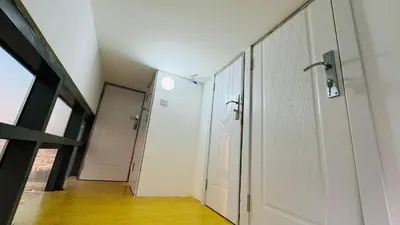a hallway with a white door in a room at Modern Homestay Oval Tower, Business Bay in Dubai