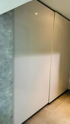a large white wall in a room with at Modern Homestay Oval Tower, Business Bay in Dubai