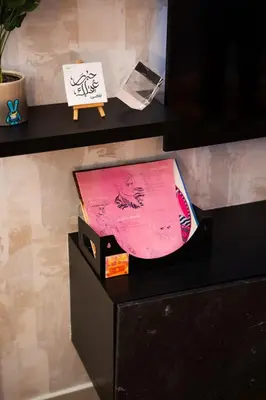 a table with a box on top of a shelf at Designer Suite with Skyline views in Dubai