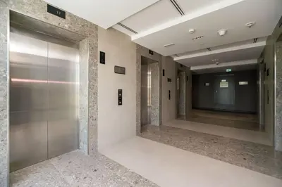a hallway with a large mirror in a building at Bella Casa - Luxury 1BR Apartment - Brand New Furniture in Dubai