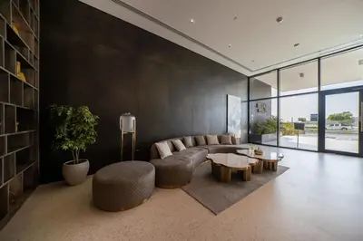 a living room with a couch and a table at Bella Casa - Luxury 1BR Apartment - Brand New Furniture in Dubai