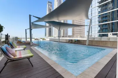a swimming pool on the roof of a building at Live the Opulenco Experience! 2BR Urban Oasis by Missoni, Business Bay in Dubai
