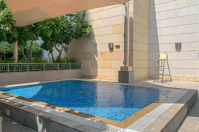 a swimming pool in the side of a building at Frank Porter - Claren Tower 2, Downtown in Dubai