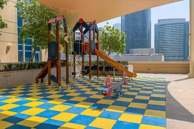 a playground with a checkered floor and slides at Frank Porter - Claren Tower 2, Downtown in Dubai