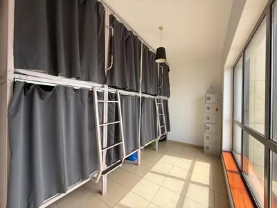 a room with gray curtains on a wall at Simbad Friendly Coliving in Dubai
