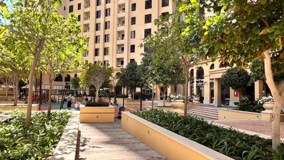 a street in a city with a large building at Simbad Friendly Coliving in Dubai