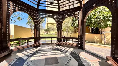 an outdoor patio with arches and a courtyard at Simbad Friendly Coliving in Dubai