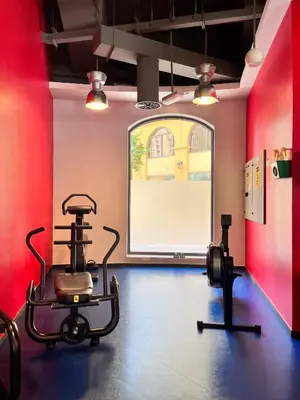 a room with a gym with a bike and weights at Simbad Friendly Coliving in Dubai