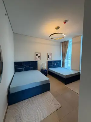 a bedroom with two beds and a ceiling at Private room in BURJ KHALIFA facing 3BR luxury apartment in Downtown Near Dubai Mall Metro in Dubai