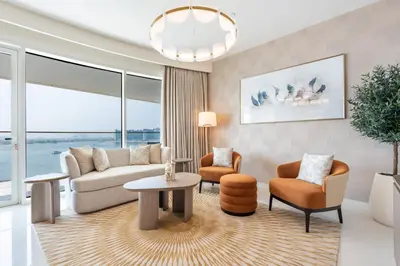 a living room with a couch and chairs and a table at Fantastic 2BR apartment Palm, Sea and Sunset Views in Dubai