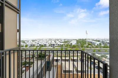 a balcony with a view of a city at 1BR Little Haven in Collective T1, Dubai Hills in Dubai