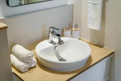 a bathroom with a white sink in a caravan at 1BR Little Haven in Collective T1, Dubai Hills in Dubai