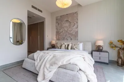 a bedroom with a large bed and a large mirror at The Smart Concierge - Stella Maris in Dubai