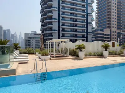 a swimming pool on the roof of a building at The Smart Concierge - Stella Maris in Dubai