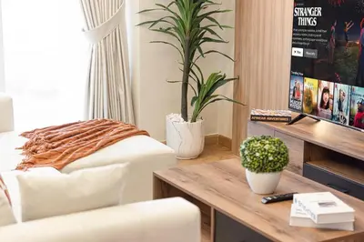a living room with a couch and a table at Elegant 3BR Lux Stay in the Heart of Dubai Marina in Dubai