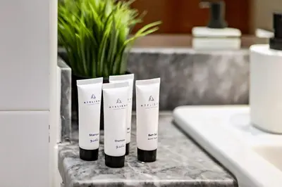 three tubes of toothbrushes sitting on a counter at Stylish 1BR Apartment at Meera Tower in Dubai