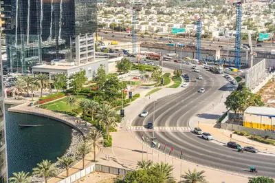 an aerial view of a street in a city at Modern Apt just Steps to Metro & Lake with Pool andParking in Dubai