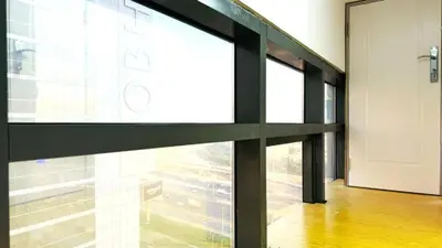a glass door in a building with a hallway at Oval Tower Retreat, Business Bay in Dubai