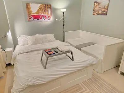 a bedroom with a bed with a table on it at Modern Studio Near Dubai World Trade Centre in Dubai