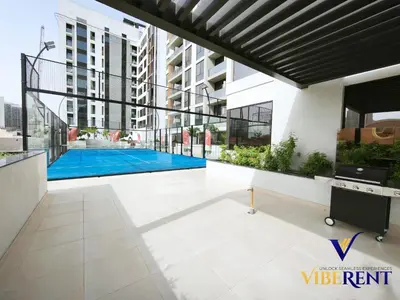 a view of a building with a swimming pool at 1BHK Pool Sauna 15 Min to Marina in Dubai