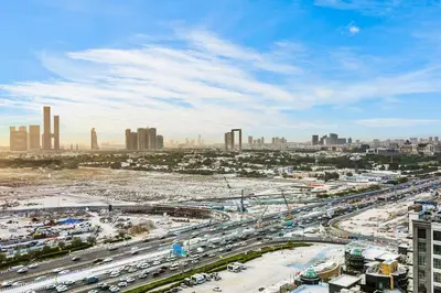 a busy freeway in a large city with traffic at Spacious 3BR Family Stay with Balcony Views of Burj and City Lights in Dubai