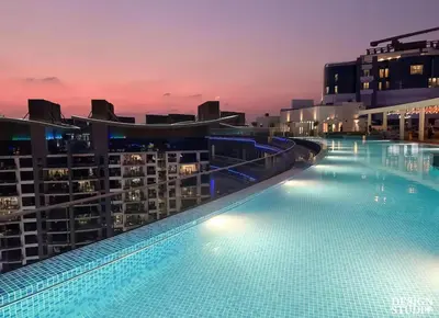 a large swimming pool on top of a building at Beachfront Bliss Seven Palm in Dubai