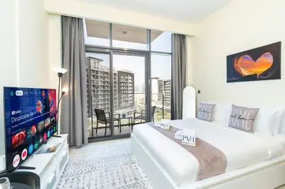 a bedroom with a large bed and a large window at PVH - Azizi Riviera - Lovely Studio near Downtown in Dubai