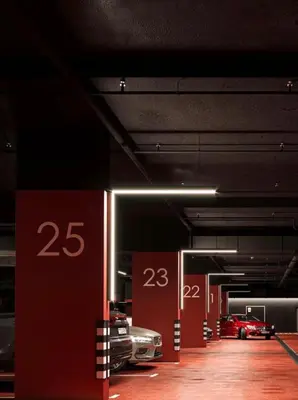 a parking garage with several cars parked in it at Luxury Modern Apt in JBR 2 MIN to BEACH in Dubai