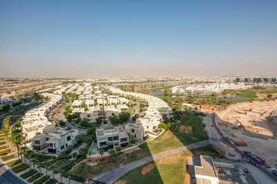 an aerial view of a city with white houses at PVH - Golf Vita - 1BR with Golf Course View in Dubai