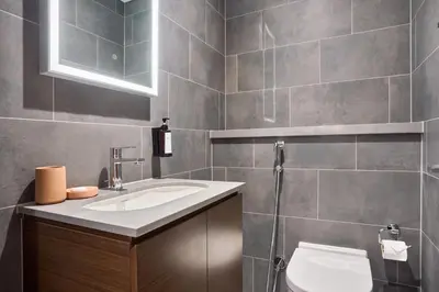 a bathroom with a sink and a toilet at STAY BY LATINEM Luxury 1BR Holiday Home CA 0906 Near Burj Khalifa in Dubai