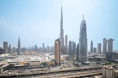 a view of a large city with tall buildings at Serene 2BR Burj View DT Dubai in Dubai