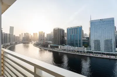 a view of a river in a city with tall buildings at GuestReady - Canal View Stay in Business Bay in Dubai