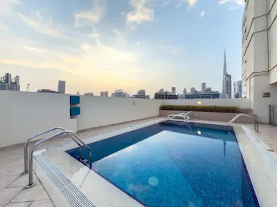 a swimming pool on the roof of a building at GuestReady - Canal View Stay in Business Bay in Dubai
