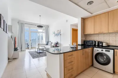 a kitchen with a washer and dryer at GuestReady - Canal View Stay in Business Bay in Dubai