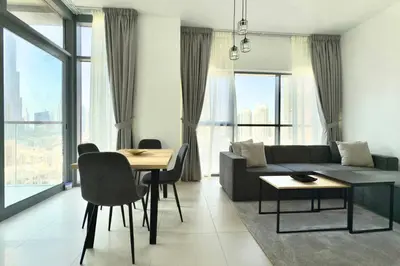 a living room with a couch and a table at 1 Bedroom Apt with Stunning Burj Khalifa View in Dubai
