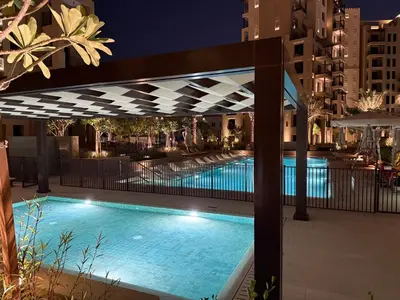 a swimming pool at night with a canopy over it at Elegant 2 Bedroom Apartment - Jadeel 2, Madinat Jumeirah - Allsopp & Allsopp in Dubai