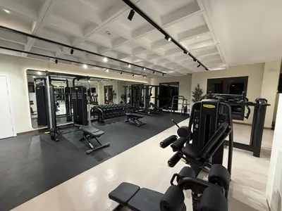 a gym with several treadmills and machines at Elegant 2 Bedroom Apartment - Jadeel 2, Madinat Jumeirah - Allsopp & Allsopp in Dubai